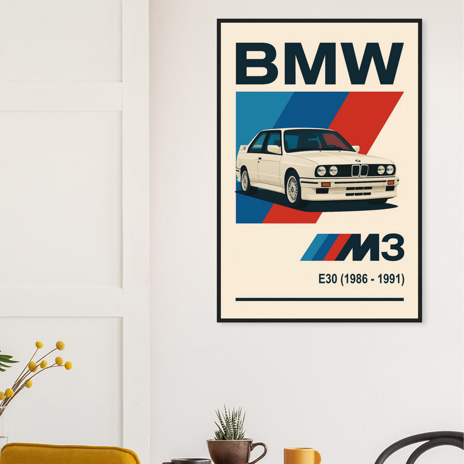 BMW M3 poster on a wall above a wooden table with chairs.